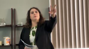 A woman doing a presentation. (Alex)